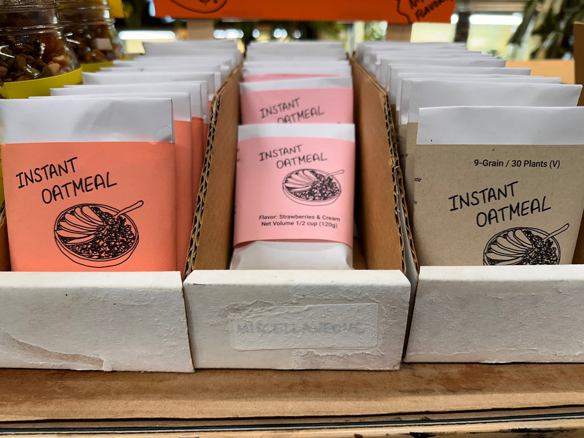 Instant oatmeal packages on a shelf with visible branding and product names.