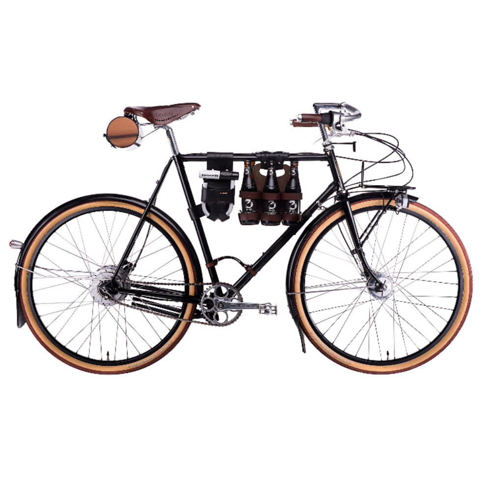 Black bicycle on a white background with several walnut studiolo accessories. Among the featured bicycle accessories are a "little lifter" bike handle, the "spartan carton" beer holder, and the "barrel bag" saddle bag.