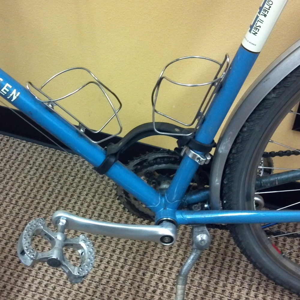 Black leather "little lifter" bike handle shown on blue bike frame